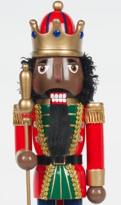 Close-up of deep-brown-skin Black king nutcracker with natural curls and full beard