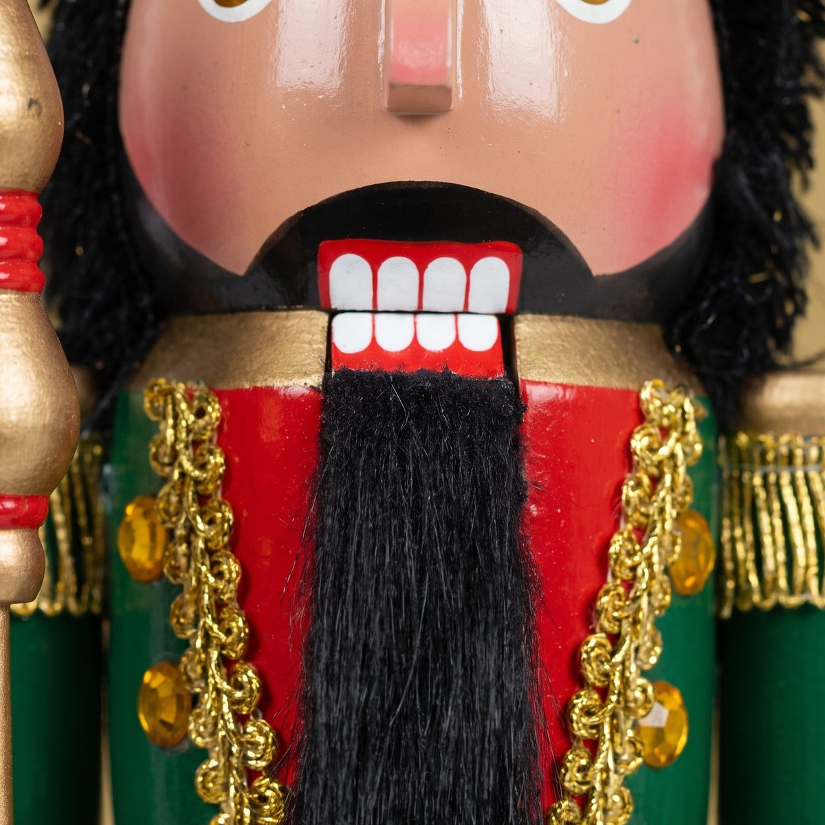 Close-up of the Maple King nutcracker's textured beard and hand-painted facial features