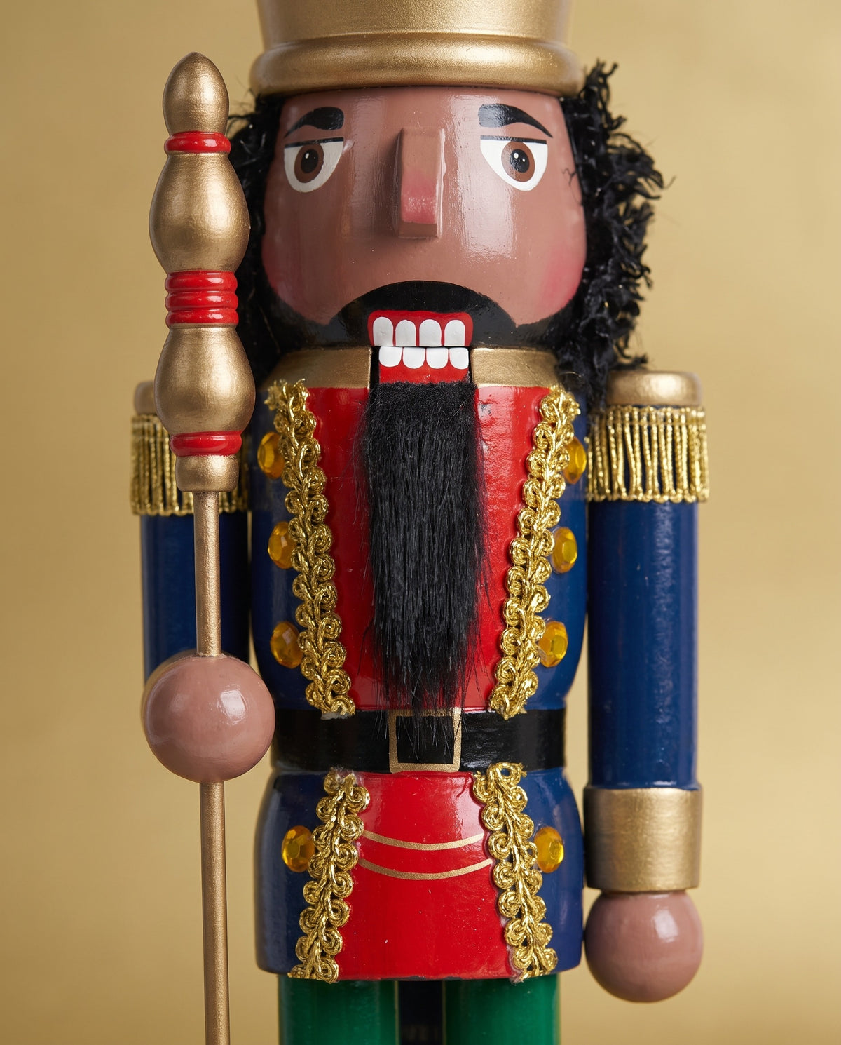 Close-up of the Walnut King nutcracker's textured beard and hand-painted facial features